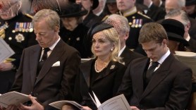 Mrs T's daughter-in-law, flanked her son and grandson